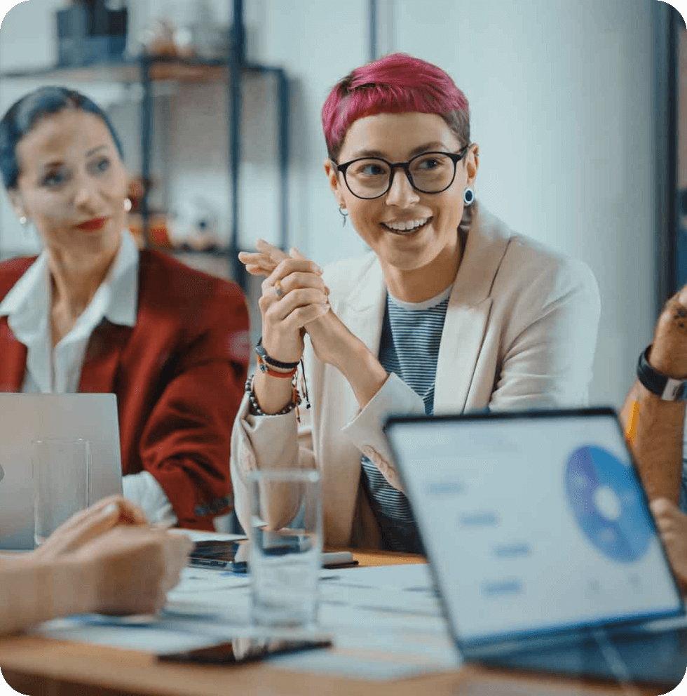 Woman smiling during a meeting.